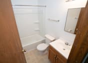 Thumbnail 8 of 10 - a small bathroom with a sink toilet and shower
