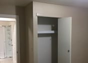 Thumbnail 12 of 12 - a bedroom with a bed and a closet
