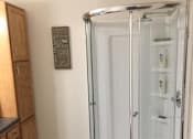 Thumbnail 10 of 12 - a shower with a glass door in a bathroom