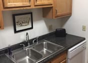 Thumbnail 5 of 12 - a kitchen with a sink and a dishwasher