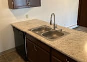 Thumbnail 12 of 15 - a kitchen with a sink and a dishwasher