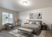Thumbnail 6 of 11 - A bedroom with a large bed and a grey chair.