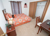 Thumbnail 10 of 17 - Bedroom with cozy bed at Oates Estates Apartments, Alabama