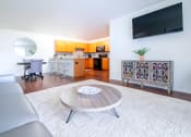Thumbnail 3 of 9 - Living Room With TV at Fuller Apartments, Perrysburg, OH, 43551