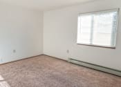 Thumbnail 2 of 5 - an empty room with carpet and a window
