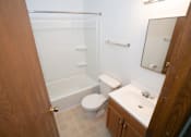 Thumbnail 9 of 11 - a bathroom with a toilet and a sink