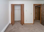 Thumbnail 5 of 11 - a bedroom with a closet and a door to a bathroom