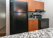 Thumbnail 13 of 24 - Granite Counter Tops In Kitchen at Raleigh House Apartments, MRD Apartments, Michigan