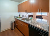 Thumbnail 14 of 24 - Stainless Steel Sink With Faucet In Kitchen at Raleigh House Apartments, MRD Apartments, East Lansing, MI, 48823