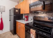Thumbnail 16 of 43 - Kitchen  at Walker Estates Apartments, Augusta, Georgia