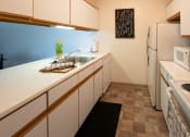 Thumbnail 11 of 33 - Fully Furnished Kitchen at Woodbury Estates Apartments, Adrian, MI, 49221