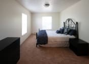 Thumbnail 23 of 33 - Carpeted Bedroom at Woodbury Estates Apartments, Adrian