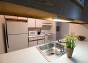 Thumbnail 10 of 33 - Sink With Faucet at Woodbury Estates Apartments, Michigan, 49221