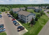Thumbnail 3 of 33 - Drone View Of Exterior at Woodbury Estates Apartments, Michigan, 49221