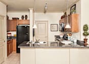 Thumbnail 6 of 24 - The Legacy at Walton Overlook Apartment Kitchen