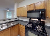 Thumbnail 26 of 33 - Walton Reserve Apartment Home Renovated Kitchen