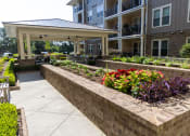 Thumbnail 25 of 40 - an outdoor seating area at the enclave at woodbridge apartments in sugar land, tx