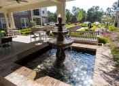 Thumbnail 27 of 40 - a fountain in front of a building