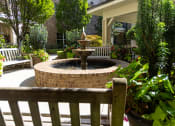 Thumbnail 22 of 40 - a fountain in front of a building