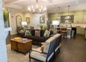 Thumbnail 7 of 40 - a living room filled with furniture and a chandelier