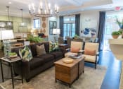 Thumbnail 11 of 40 - a living room filled with furniture and a large window