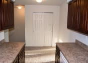 Thumbnail 26 of 37 - Granite Counter Tops In Kitchen at Brookwood at Ridge, New York, 11961