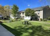 Thumbnail 11 of 37 - Beautiful green area in front of apartments at Brookwood at Ridge, New York