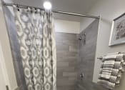 Thumbnail 17 of 37 - Modern Sleek Bathroom at Brookwood at Ridge, New York, 11961