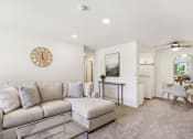 Thumbnail 18 of 37 - a living room with a couch and a coffee table at Brookwood at Ridge, New York, 11961