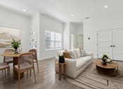 Thumbnail 1 of 48 - A modern living room with a white sofa, wooden coffee table, and a dining table with chairs.