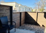 Thumbnail 43 of 48 - the patio has a privacy fence and chairs on it