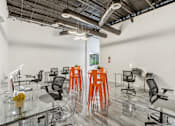 Thumbnail 14 of 38 - a room filled with chairs and tables and exposed pipes