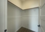 Thumbnail 24 of 48 - a room with white walls and a wooden floor and a white ceiling and white door