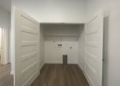 Thumbnail 19 of 48 - a room with white walls and a wooden floor