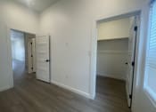 Thumbnail 21 of 48 - a bedroom with a closet and an open door