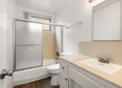 Thumbnail 7 of 23 - a bathroom with a sink toilet and shower