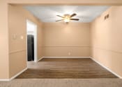 Thumbnail 4 of 23 - a empty room with a ceiling fan and a door