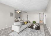 Thumbnail 2 of 17 - A living room with a white couch and a small table with a plant on it.