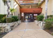 Thumbnail 1 of 23 - the entrance to a building with a stone walkway and a gate