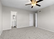 Thumbnail 9 of 17 - A room with a ceiling fan and a white radiator.