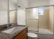 Thumbnail 5 of 18 - a bathroom with a sink toilet and shower