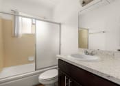 Thumbnail 11 of 18 - a bathroom with a sink toilet and shower