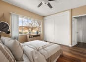 Thumbnail 4 of 18 - a bedroom with a bed and a ceiling fan