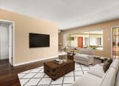 Thumbnail 1 of 18 - a living room with a white couch and a television
