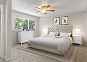 Thumbnail 7 of 23 - A bedroom with a large bed, a dresser, and a ceiling fan.