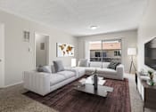 Thumbnail 1 of 23 - A living room with a white couch and a world map on the wall.