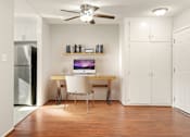 Thumbnail 3 of 47 - A room with a desk and a chair.