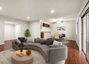 Thumbnail 1 of 44 - A living room with a grey sofa and a coffee table.