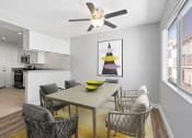 Thumbnail 5 of 38 - a dining room with a table and a ceiling fan