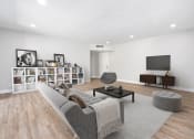 Thumbnail 1 of 38 - the living room has a large couch and a television